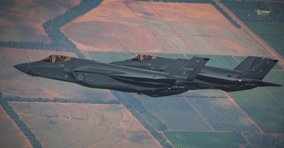 F-35 jets flying over farm